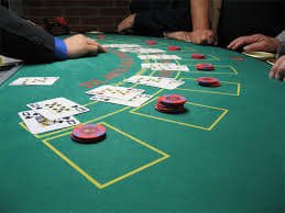 Live dealer in action at Roulette table Live dealer in action at Roulette table